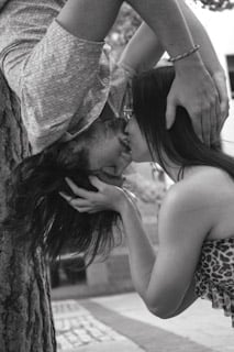 Black and white photo of two people embracing outdoors
