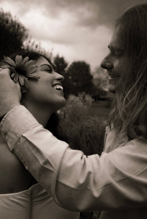 Black and white photo of two women embracing outdoors